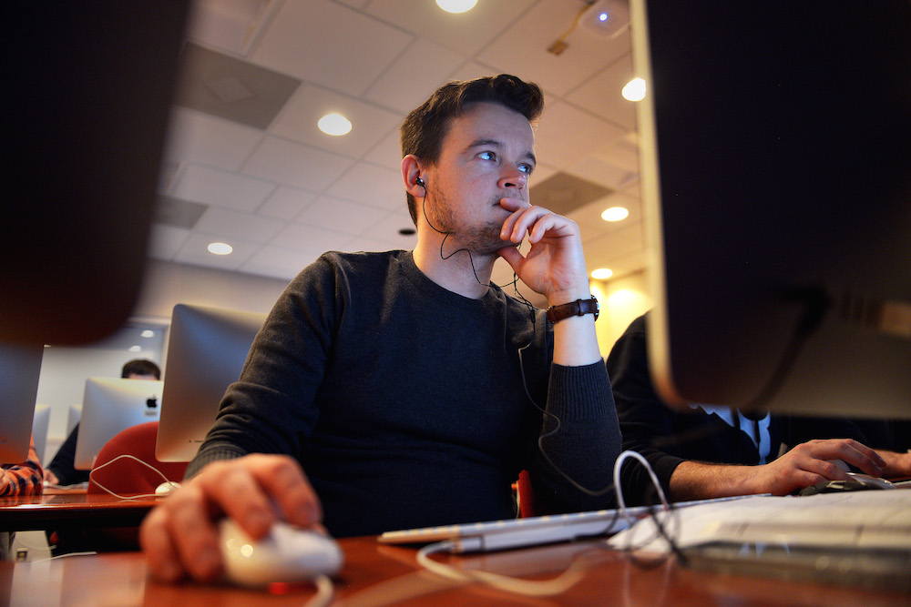 A male student uses a computer